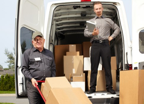 Packed household boxes and furniture ready for removals