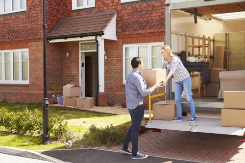 Man with a van loading furniture in Goddington