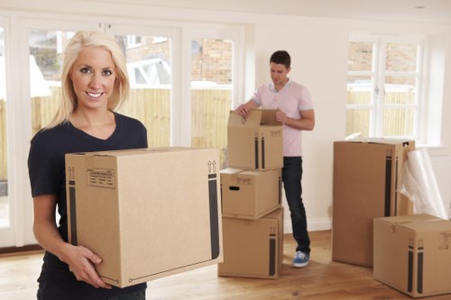 Careful loading of office furniture for collection in Goddington