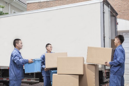 Professional movers handling furniture during a local relocation