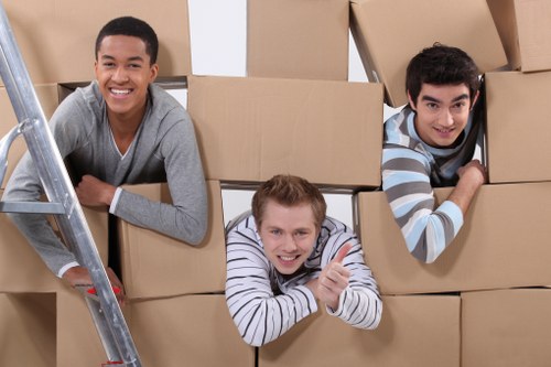 Loading furniture into a removal truck in a Goddington residential street