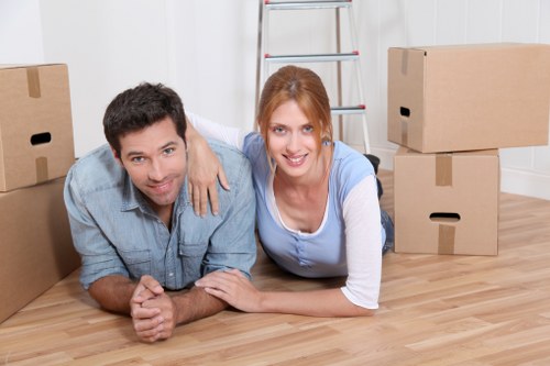 Unpacking boxes into a new home with organised room placement