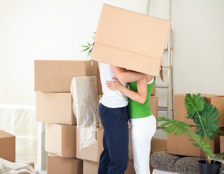 Packed moving boxes ready for transport in a Goddington property