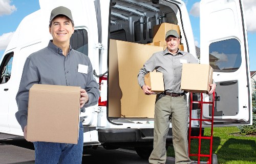 Packed moving boxes and furniture ready for collection