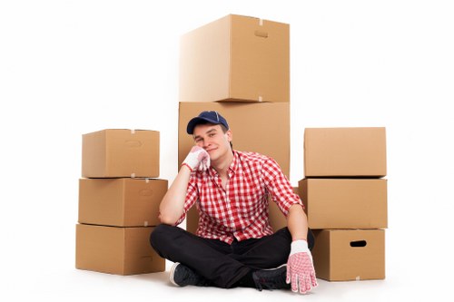 Loading furniture into a truck on a residential Goddington street